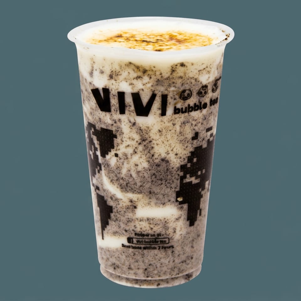 Vivi Bubble Tea cup filled with a creamy cookies-and-cream beverage against a plain blue-gray background.